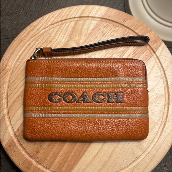 Coach Handbags - Coach Tan Leather Corner Zip Wristlet with Coach Stripes